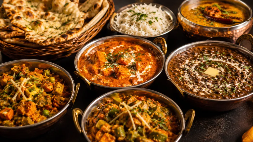 North Indian spread with paneer curries, dal makhani and naan